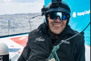 The Ocean Race 2023 – Leg 3 – Day 5 – Will Harris repairing the mast